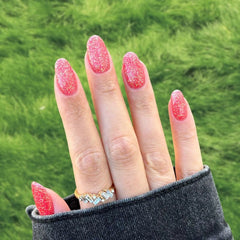 Coral Orange Dip Powder Nails showcasing a vibrant coral orange manicure.