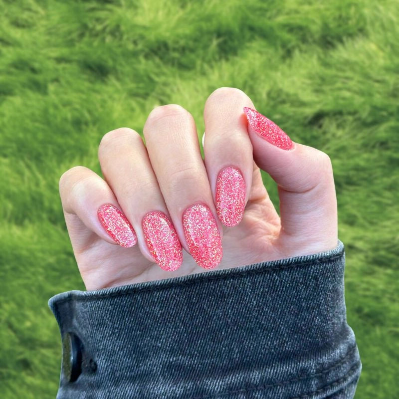 Coral Orange Dip Powder Nails for a radiant orange pedicure.