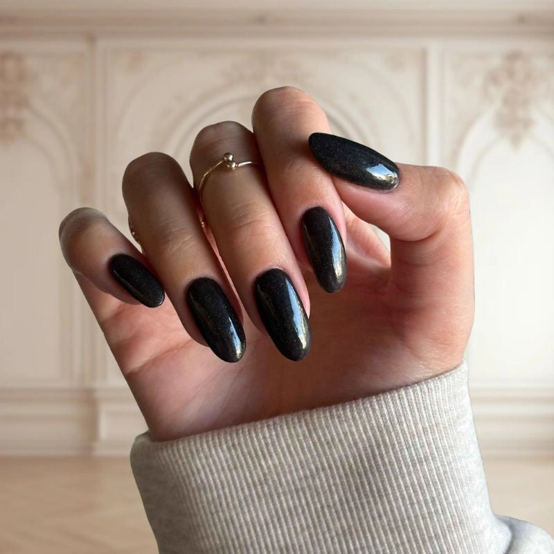 Midnight Black Shimmer Dip Powder For Nails showcasing a chic black manicure with subtle shimmer.