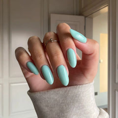 Opal Green Dip Powder For Nails showcasing a gentle green manicure with opalescent undertones for a fresh look.