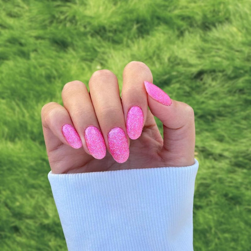 Strawberry Pink Dip Powder For Nails showcasing a lively pink manicure that adds a playful yet elegant flair to your style.