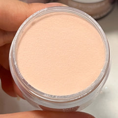 Caramel Clay dip powder in open container with warm tones
