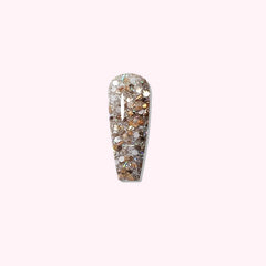 Champagne Glitz dip powder on nails, featuring multi-toned glitters in a warm champagne base