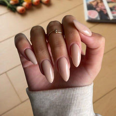 Classic Nude nails creating a smooth, refined finish for an effortlessly polished look.