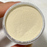 Creamy Yellow dip powder with pale yellow shimmer in a jar