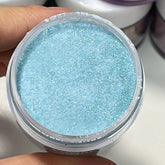 Shimmering sky blue dip nails created with Crystal Blue powder