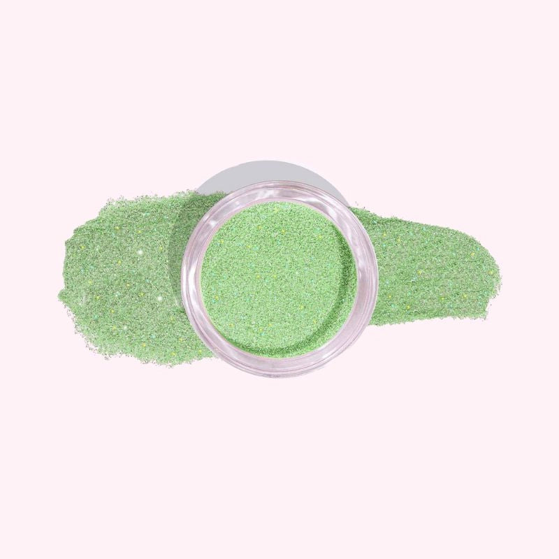 DIY manicure using Crystal Green with Fine Sparkle Dip Powder For Nails for a vibrant, sparkling finish at home.