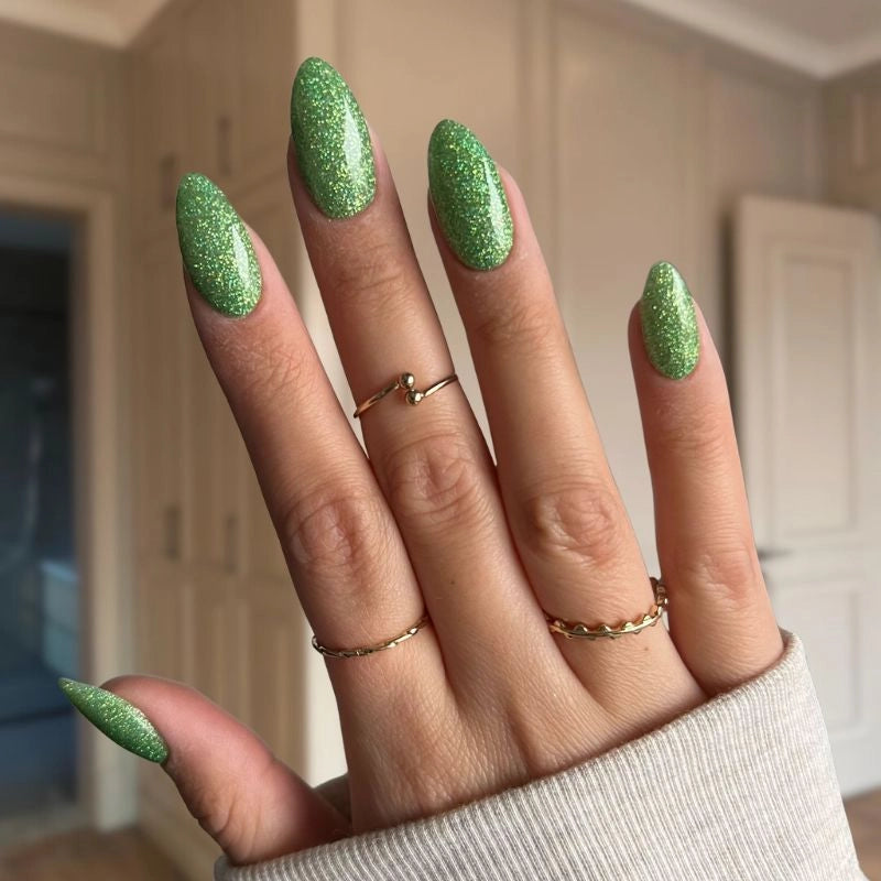 Crystal Green nails with fine sparkles creating a fresh, lively look with a shimmering, energetic effect.
