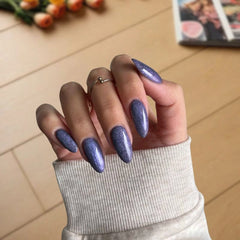 Deep Violet nails with fine sparkle creating an elegant, rich purple look with a subtle shimmering effect.