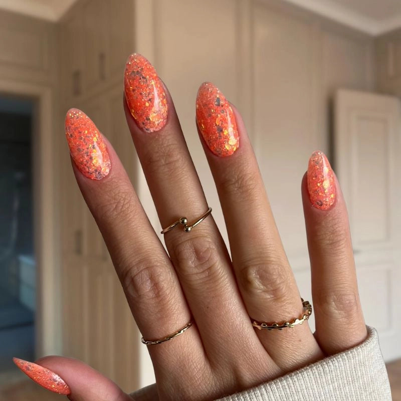 Mango Orange with Flakes nails creating a fun, sparkly at-home manicure finish.