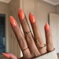 Mango Orange with Flakes nails creating a fun, sparkly at-home manicure finish.