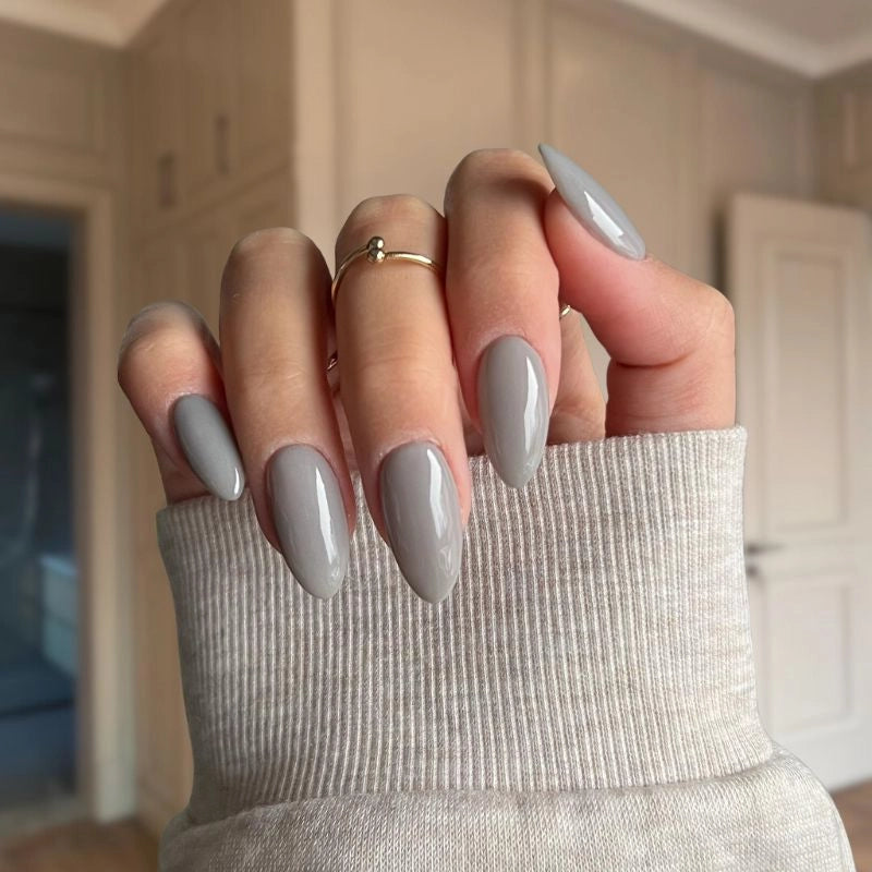 DIY manicure using Marble Grey Dip Powder For Nails for a minimalist, chic finish at home.