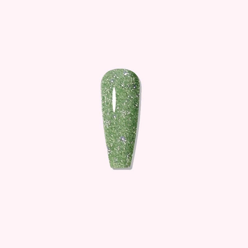 Close-up of Meadow Sparkle green glitter dip powder manicure with shimmering finish