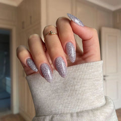 Mesmerizing Silver Dip Powder – A sparkling silver base that transforms with a purple hue in sunlight.