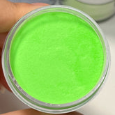 Vibrant manicure featuring Neon Lime Dip Powder with glowing fluorescent green shade