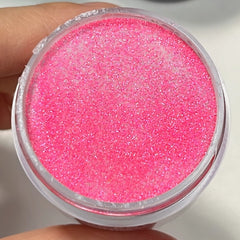 Pink Berry Gleam dip powder in bright strawberry pink with subtle sparkles