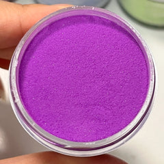 Close-up of nails painted with Smoky Eggplant Dip Powder, showing deep purple with fine sparkles