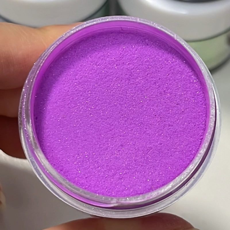 Elegant manicure featuring Smoky Sapphire Dip Powder with subtle fine sparkles and cool blue tones