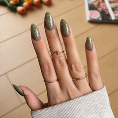 DIY manicure using Soap Green with Sparkle Dip Powder For Nails creating a soft, sparkling look at home.