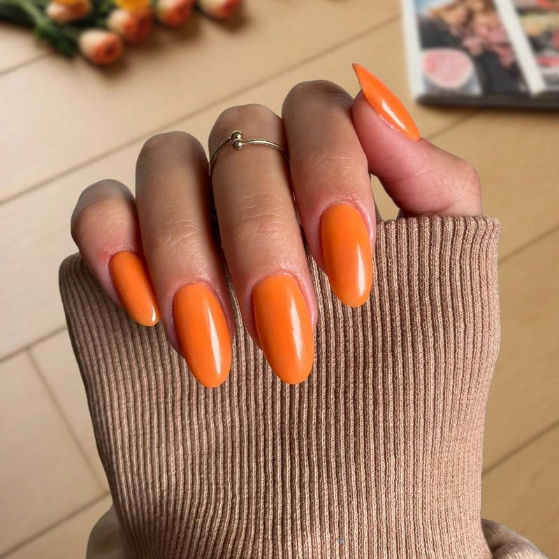 Swatch of Sweet Pumpkin Dip Powder for Nails with a rich orange color and autumn flair.