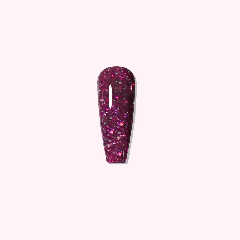 Crimson Aurora dip powder applied on nails, showing vivid red and purple with colorful glitter flakes