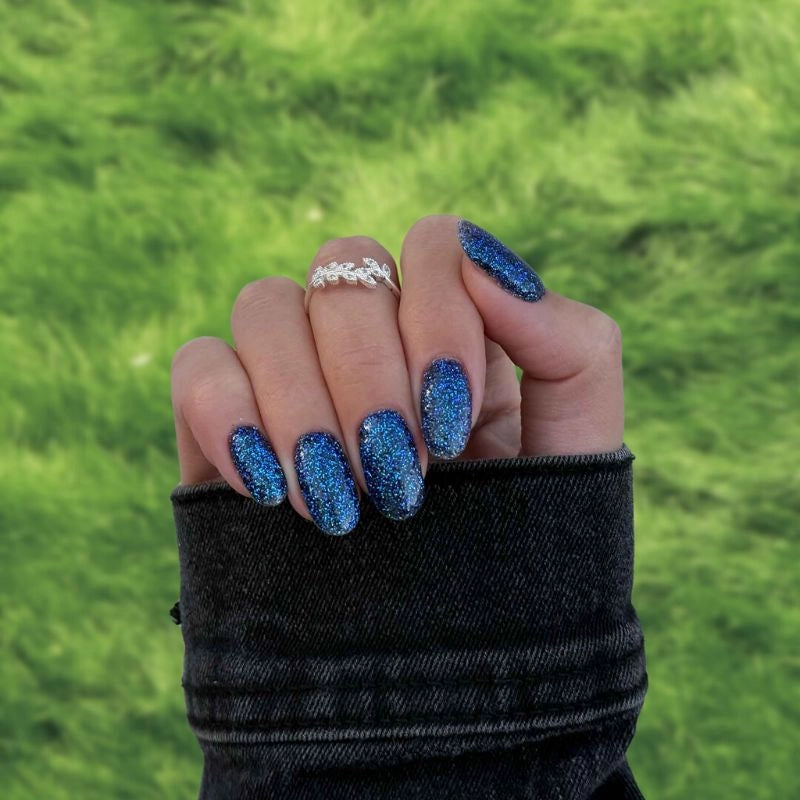 Deep Blue Shimmer Dip Powder For Nails for a sparkling deep blue pedicure with delicate shimmer, perfect for at-home pampering.