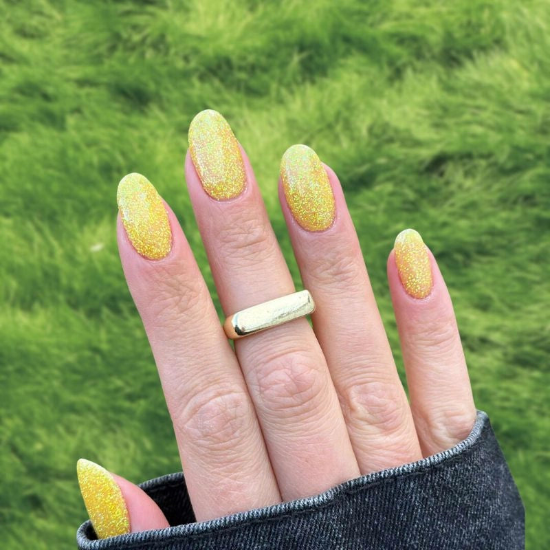 Golden Glow Dip Powder Nails for a shiny gold manicure.