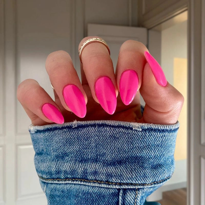 Gummy Pink Dip Powder Nails showcasing a bold and cheerful pink manicure.