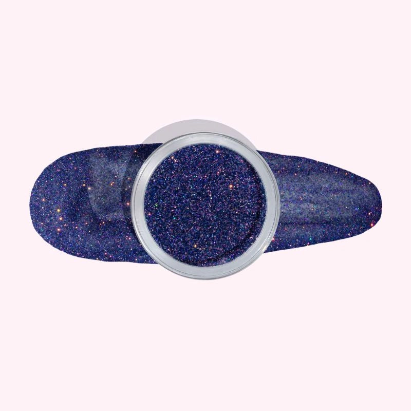 Iris Blue Dip Powder For Nails showcasing a sparkling blue-purple manicure with a touch of shimmer.