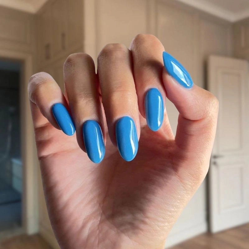 Elegant Royal Blue dip powder applied on nails, giving a bold and sophisticated finish.