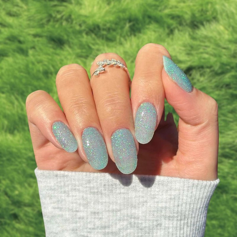 Sky Blue Dip Powder Nails for a sparkling blue manicure.