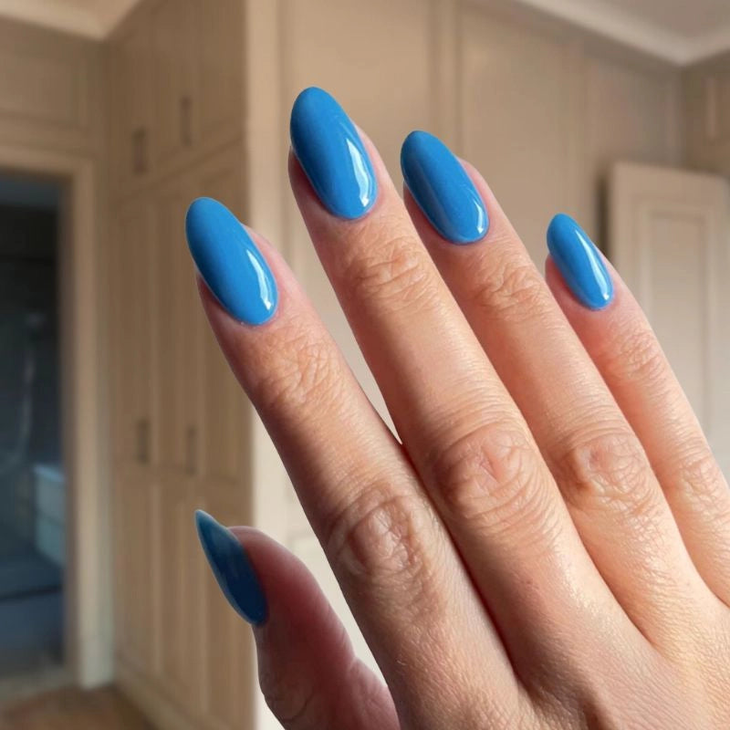 Vibrant Royal Blue dip powder used to create a chic and bold nail design with a smooth, glossy finish.