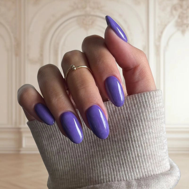 Wisteria Purple Dip Powder For Nails showcasing a bold purple manicure with bright, vibrant undertones.