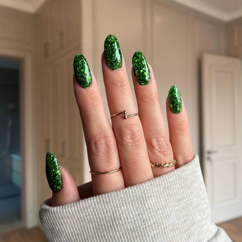 Christmas Green with Glitter nails creating a sparkling, holiday-inspired manicure.