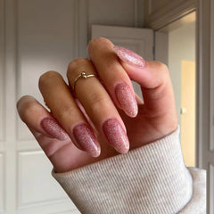 DIY manicure using Coral Pink with Sparkle Dip Powder For Nails creating a sparkling, salon-quality finish at home.