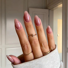 Coral Pink with Sparkle nails giving a radiant, glossy finish for a perfect at-home manicure.