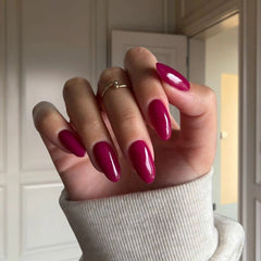 Smooth Application of Deep Magenta Dip Powder for Nails