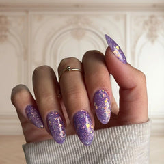 DIY manicure using Dreamy Purple with Glitter Dip Powder For Nails creating a dreamlike, glittery finish at home.