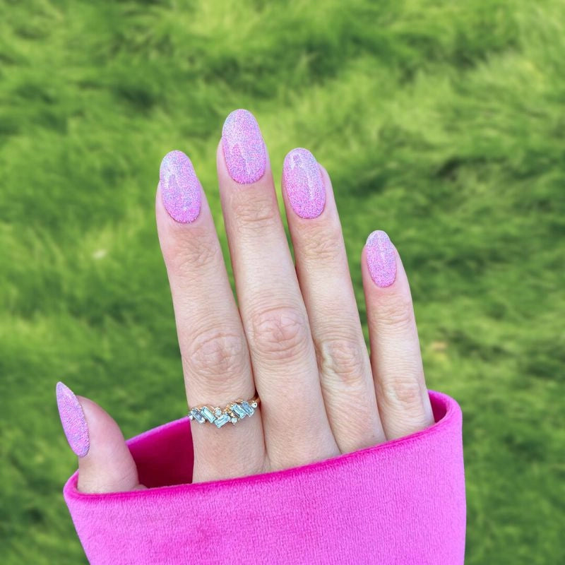 DIY Fairy Dust Pink Dip Powder Manicure – Sparkling, iridescent nails with a multi-colored shimmer.