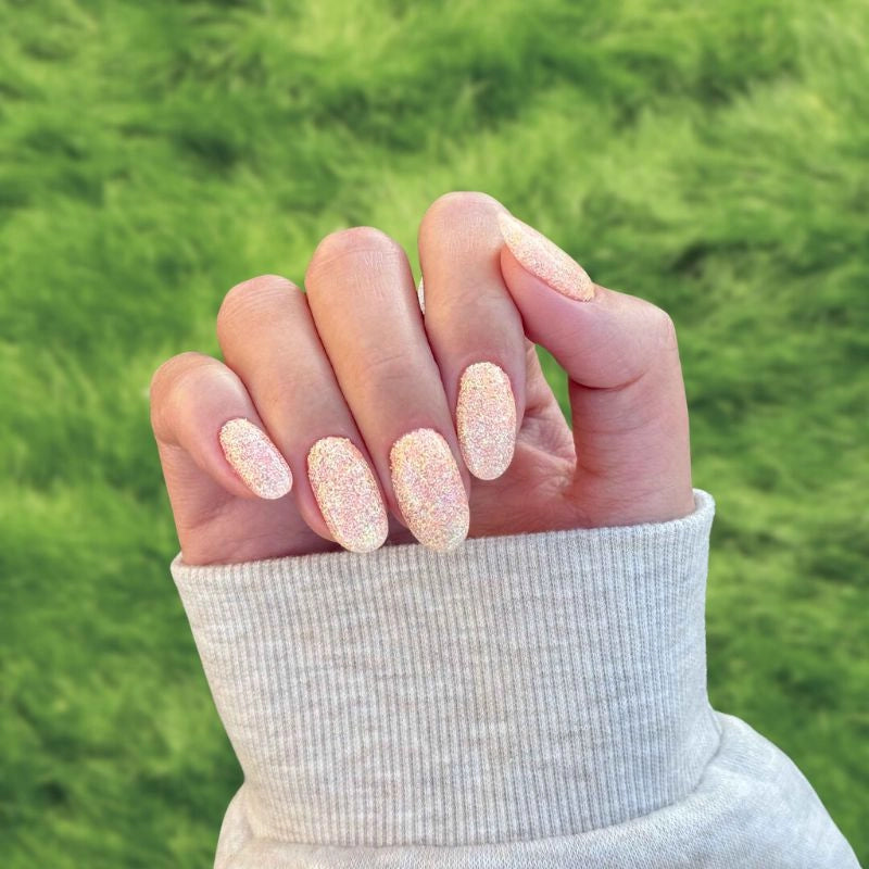 DIY manicure using Golden Sparkle Dip Powder For Nails creating a sparkling, salon-quality finish at home.