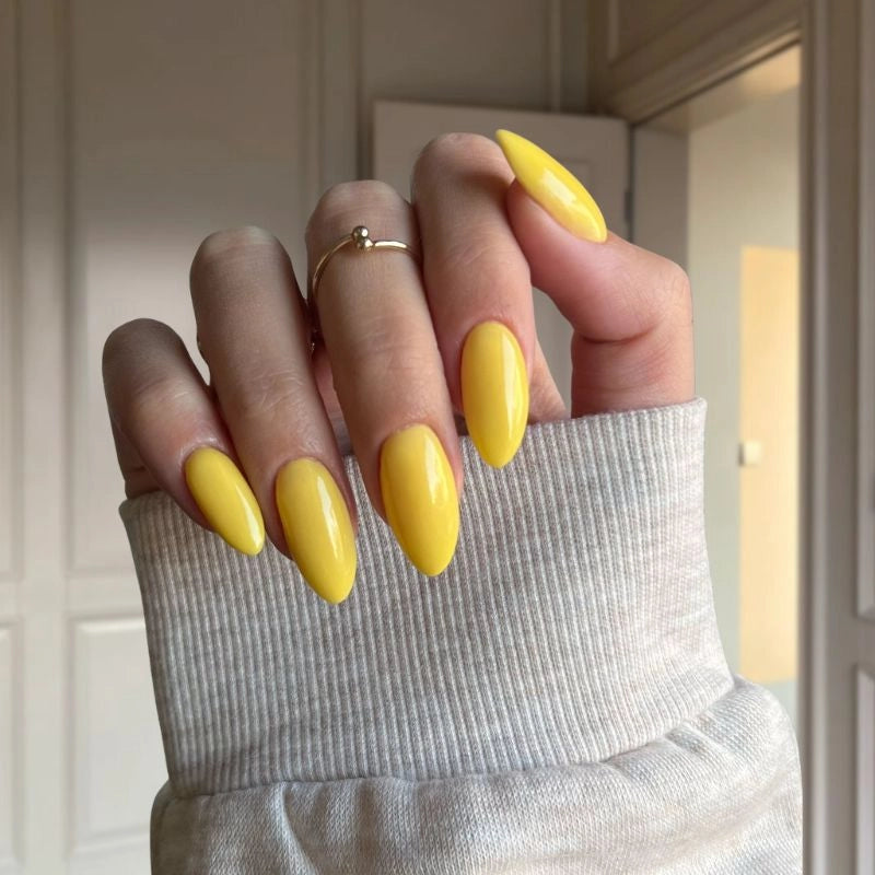 Lemon Zest nails showcasing a lively, zesty yellow for a fun, vibrant look.