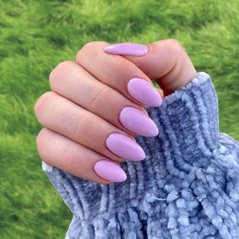 DIY manicure using Lilac Purple Dip Powder For Nails creating a soft, elegant purple finish at home.