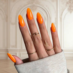 DIY manicure with Neon Orange Dip Powder For Nails giving a striking, salon-quality look at home.