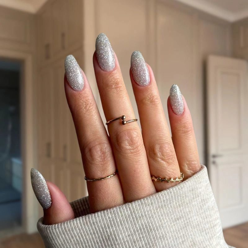 Silver Grey nails with fine sparkles creating a sophisticated, sparkling effect for an elegant look.