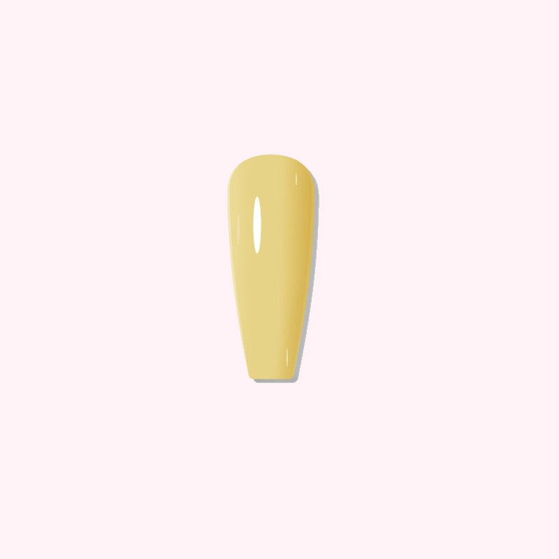 Soft Daffodil dip powder applied on nails, showing a gentle pastel yellow tone