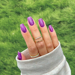 DIY Violet Sparkle Dip Powder Manicure – Bold purple nails with glitter for a glamorous look.